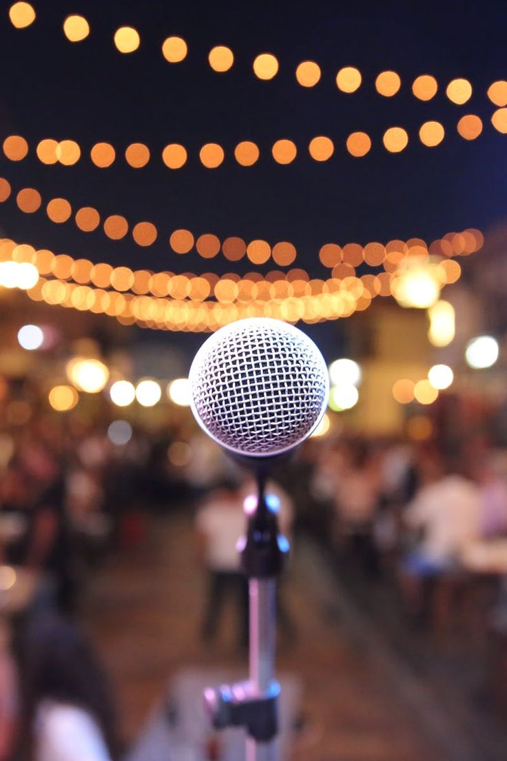 Microphone on stage with warm stage lighting
